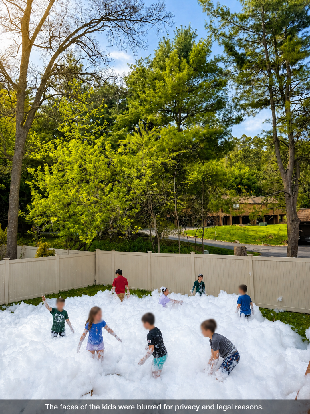 Large backyard foam party with children playing