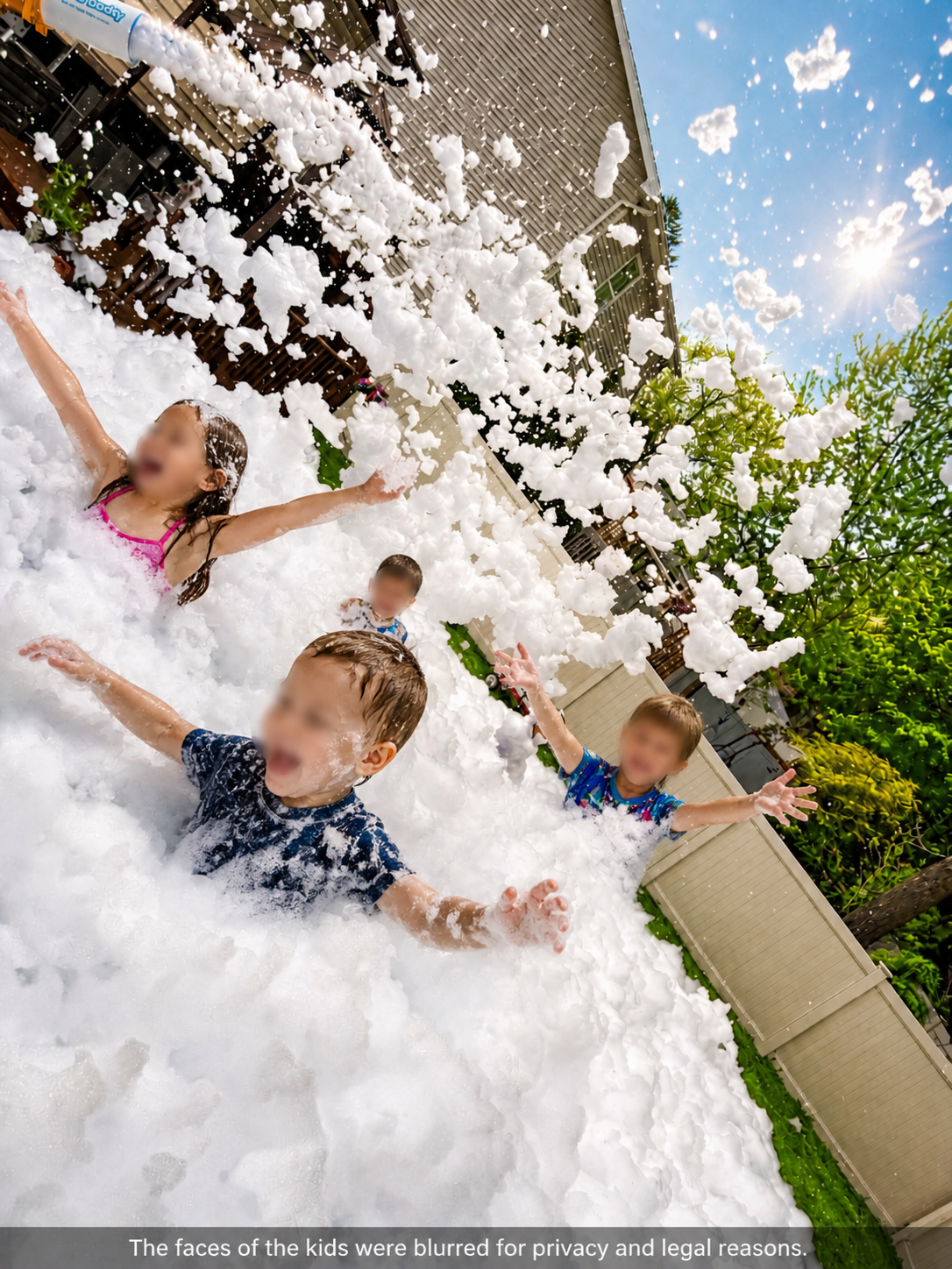 Kids throwing foam in the air at a backyard party