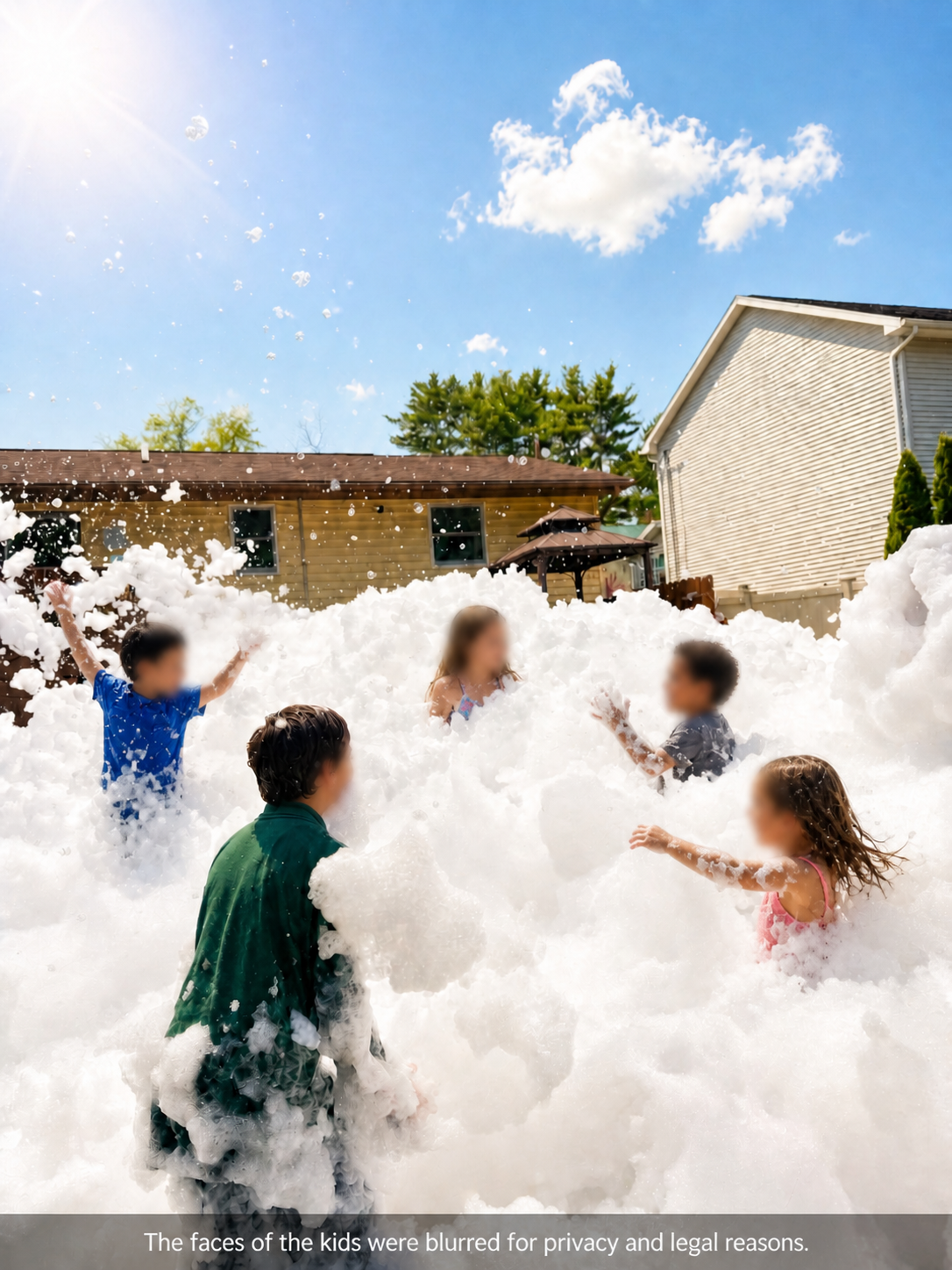 Group of kids playing in a foam-filled yard