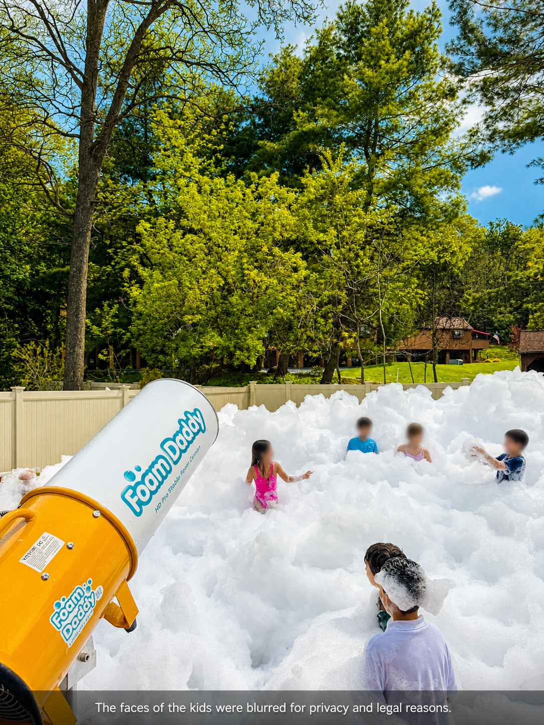 Large backyard foam party with kids playing